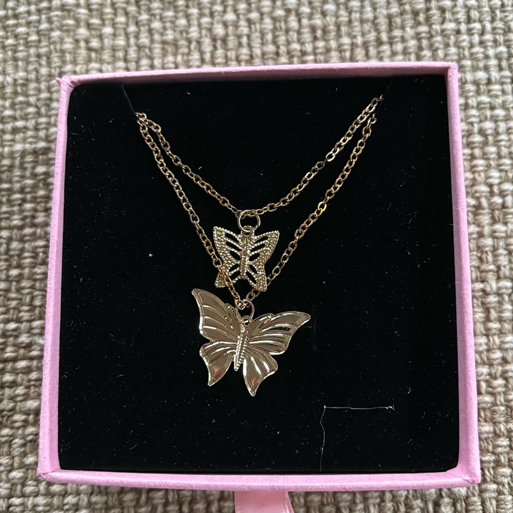 Plastic!! Gold butterfly necklace
